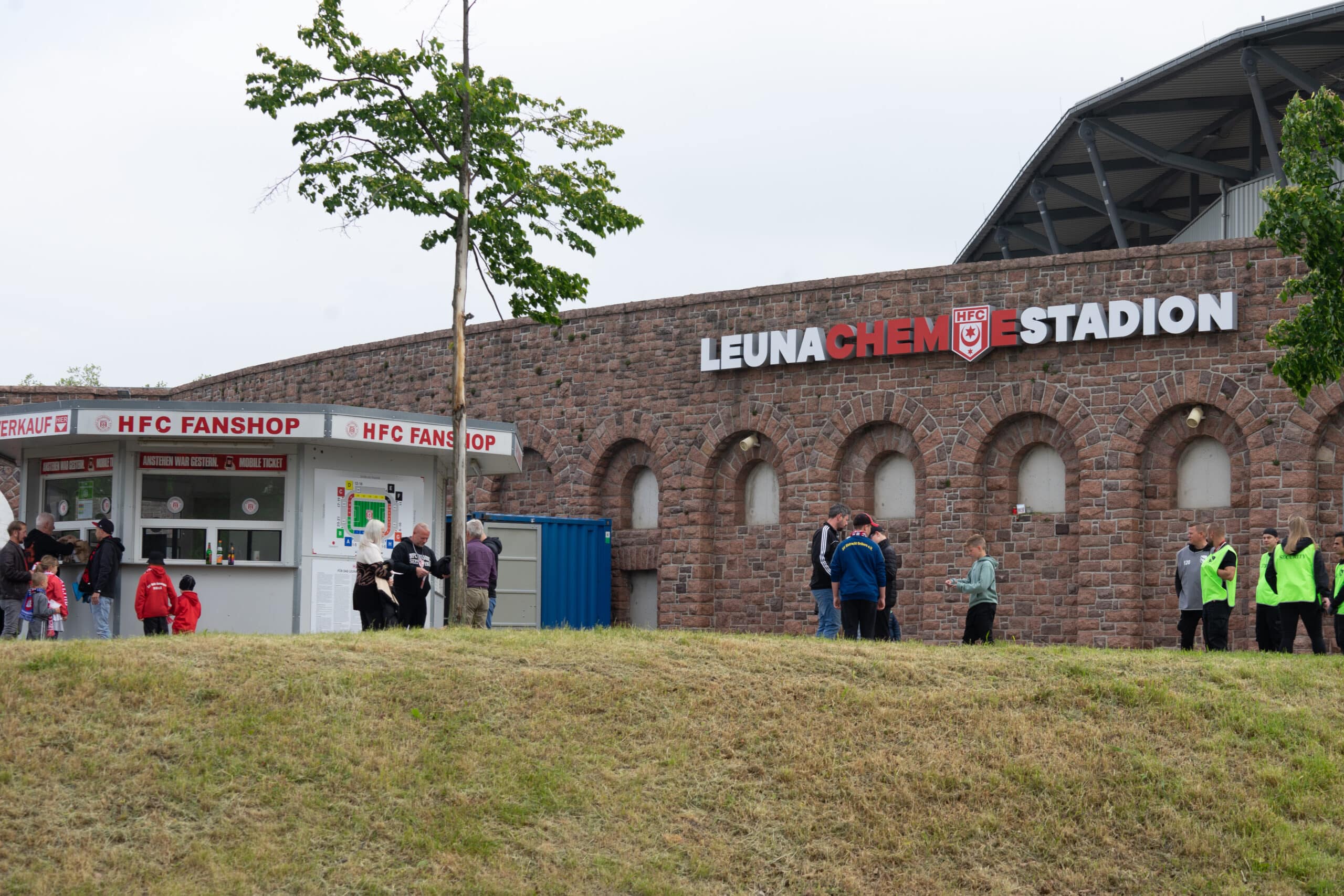 Exterior view of Leuna Chemie Stadium with historical wall of the old stadium