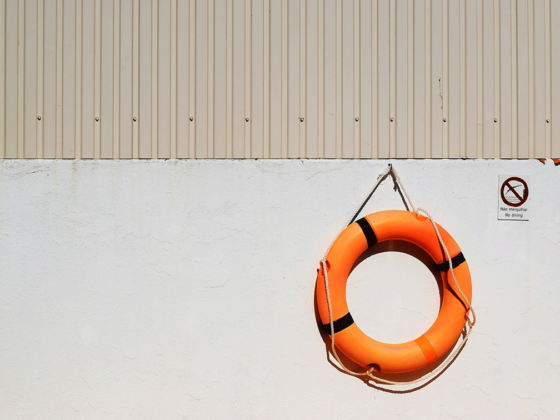 Orange lifebuoy on the wall symbolises data security at events